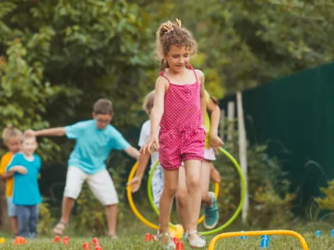 a group of children playing in a yard