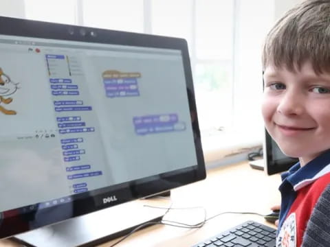 a boy smiling at the camera