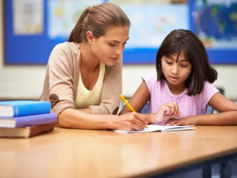 a person and a girl studying