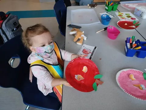 a baby sitting at a table