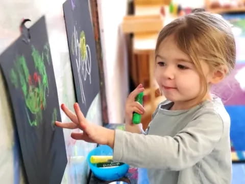 a young girl painting