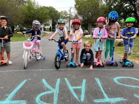 kids on bikes in a parking lot