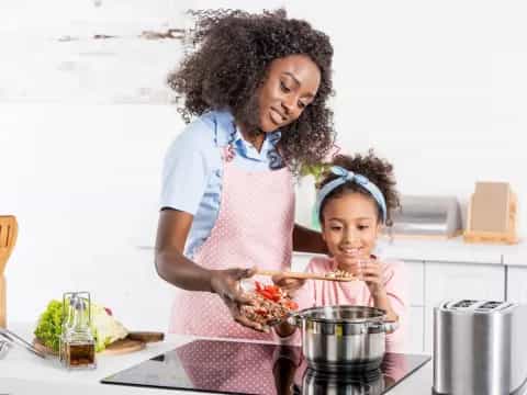 a person and a child cooking
