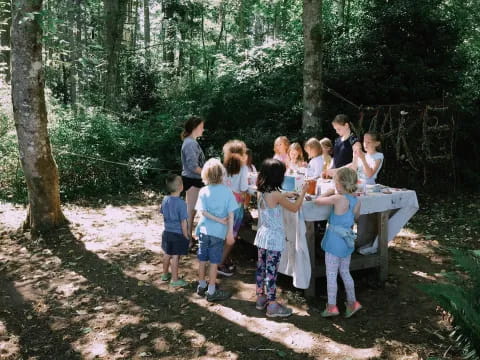 a group of children around a table