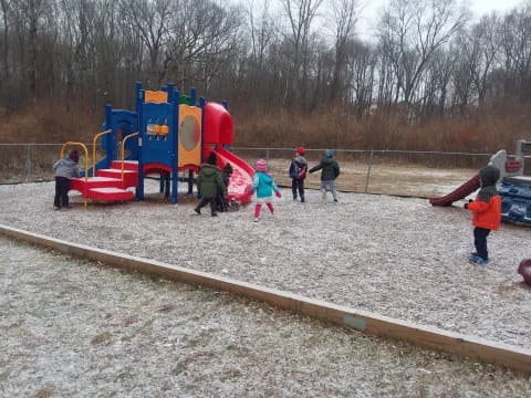 a group of people playing on a playground