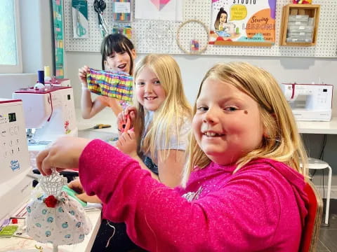 a group of girls in a kitchen