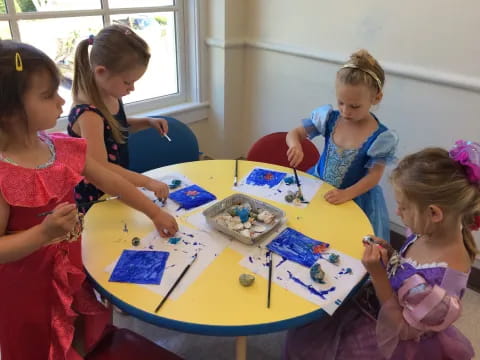 a group of girls painting