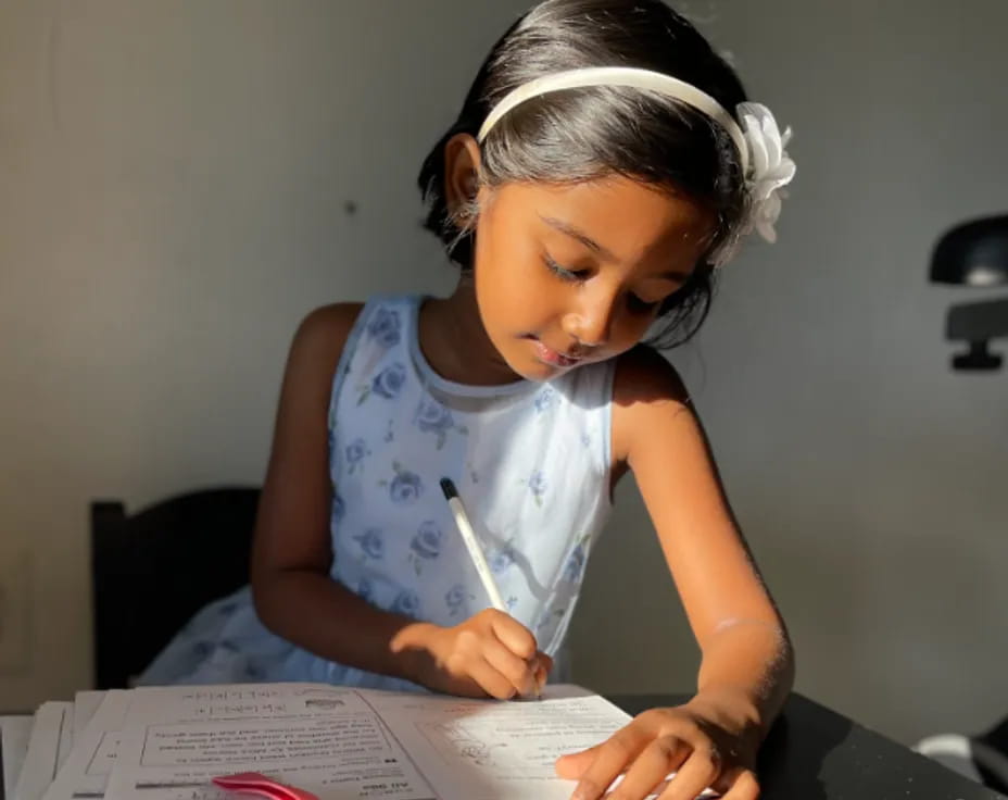 a young girl reading a book