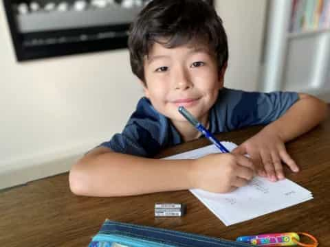 a boy with a blue toothbrush