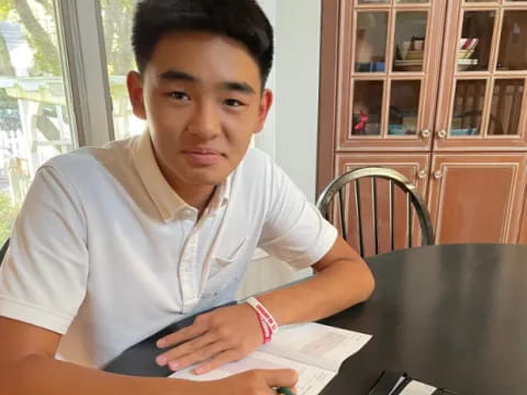 a boy sitting at a table