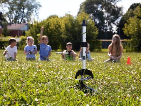 a group of kids playing in a field