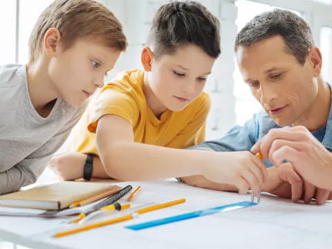 a few young boys studying