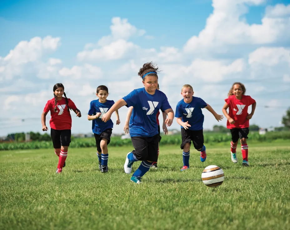 a group of kids playing football