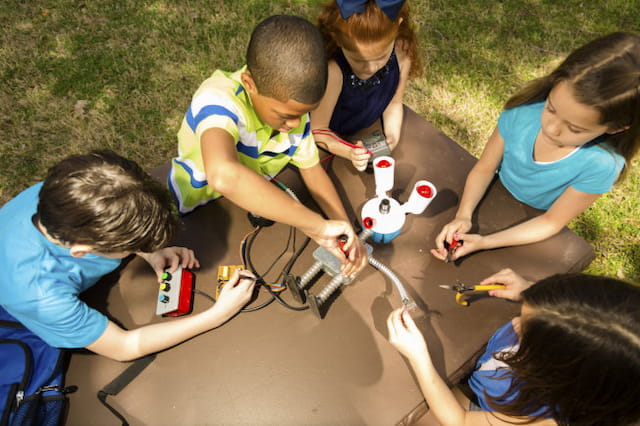 a group of children playing with toys