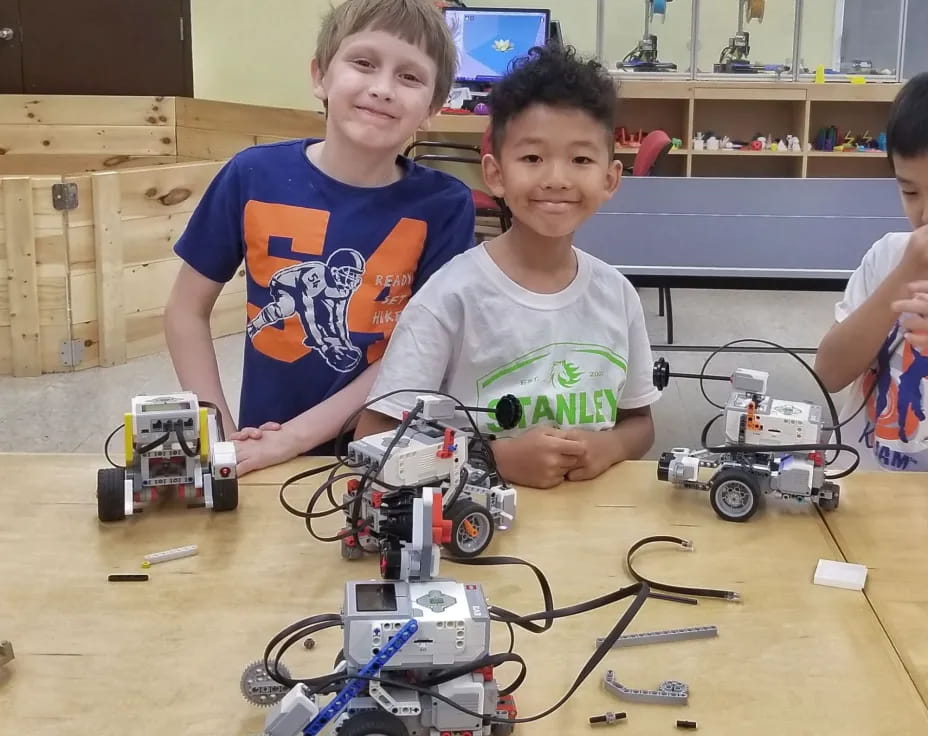 a couple of boys with toy cars