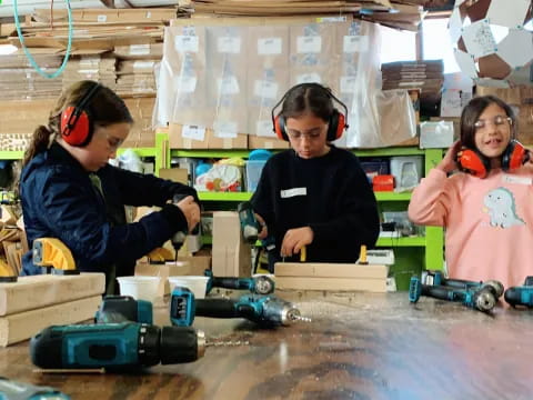 a few kids in a workshop