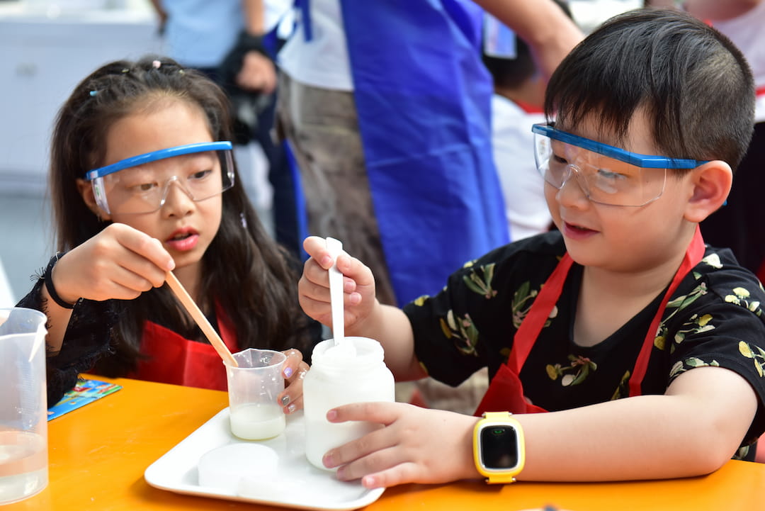 a boy and girl wearing goggles