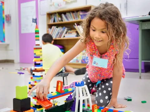 a young girl playing with toys