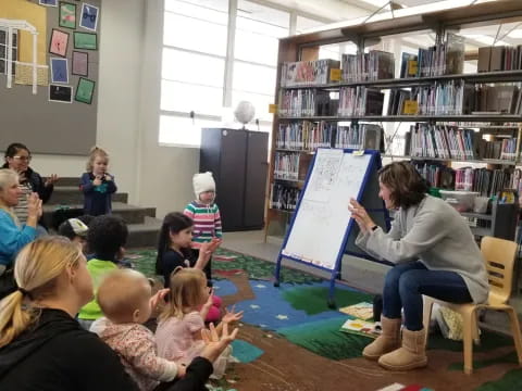 a group of people sitting in a library