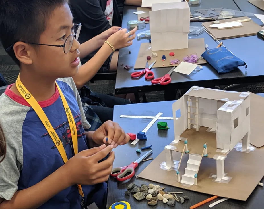 a young boy working on a project