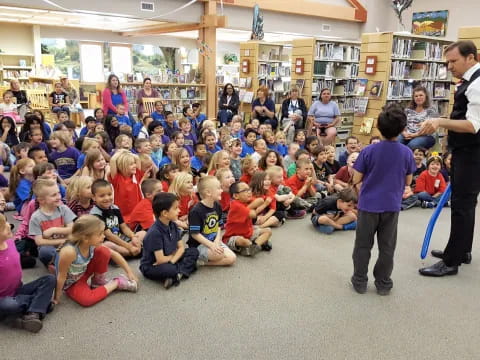 a person teaching a group of children