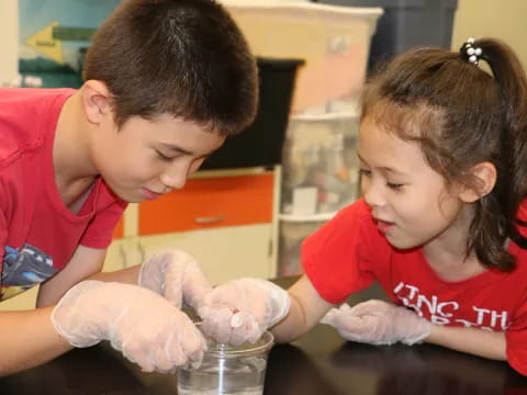 a young boy and girl in a lab