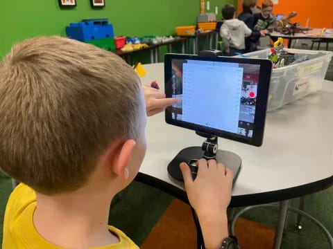a boy using a computer
