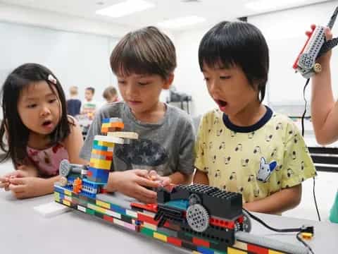 children playing with a toy train