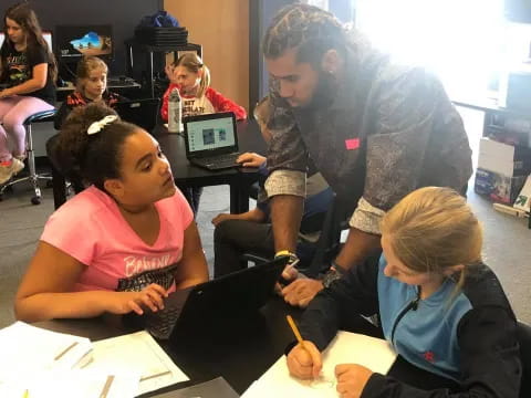 a teacher teaching her students