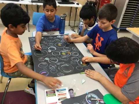 a group of boys playing a board game
