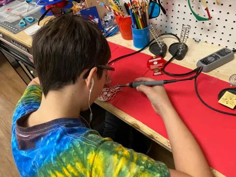 a boy with a stethoscope around his neck