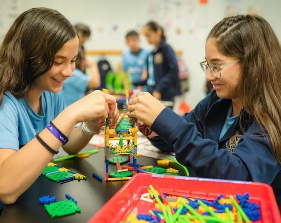 a few young girls playing with toys