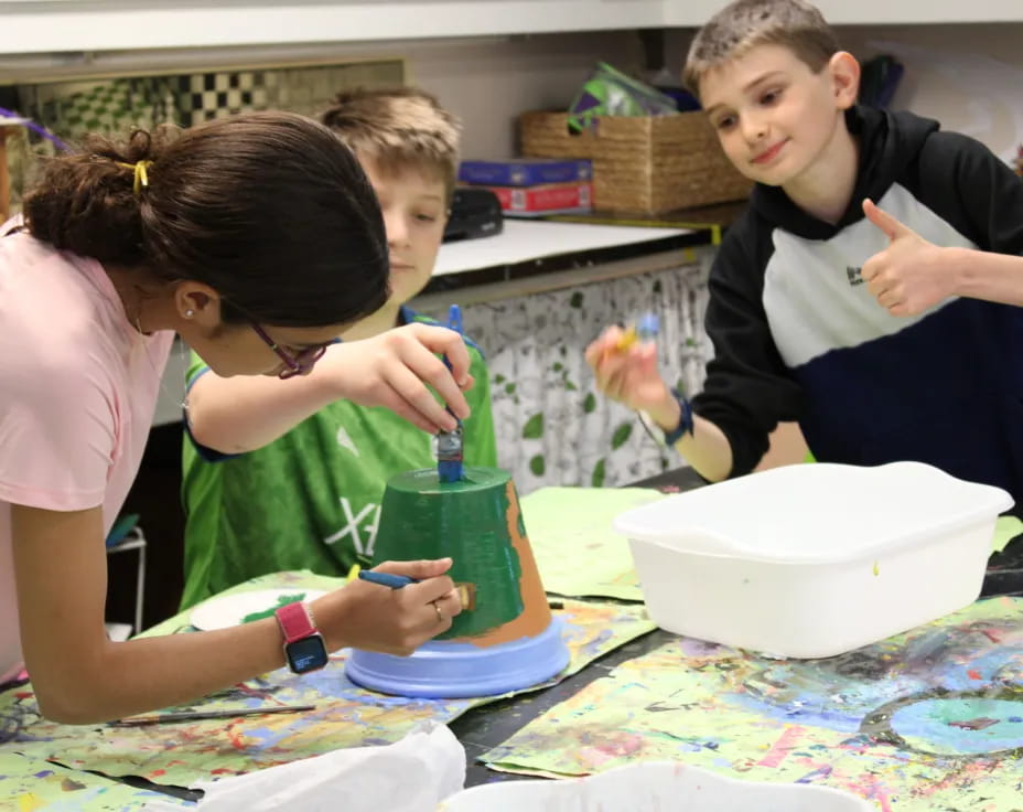 a group of people painting