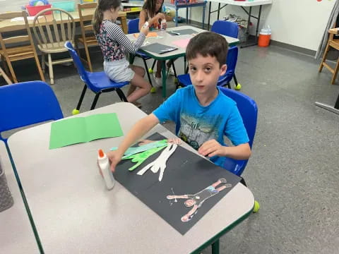 a boy sitting at a table