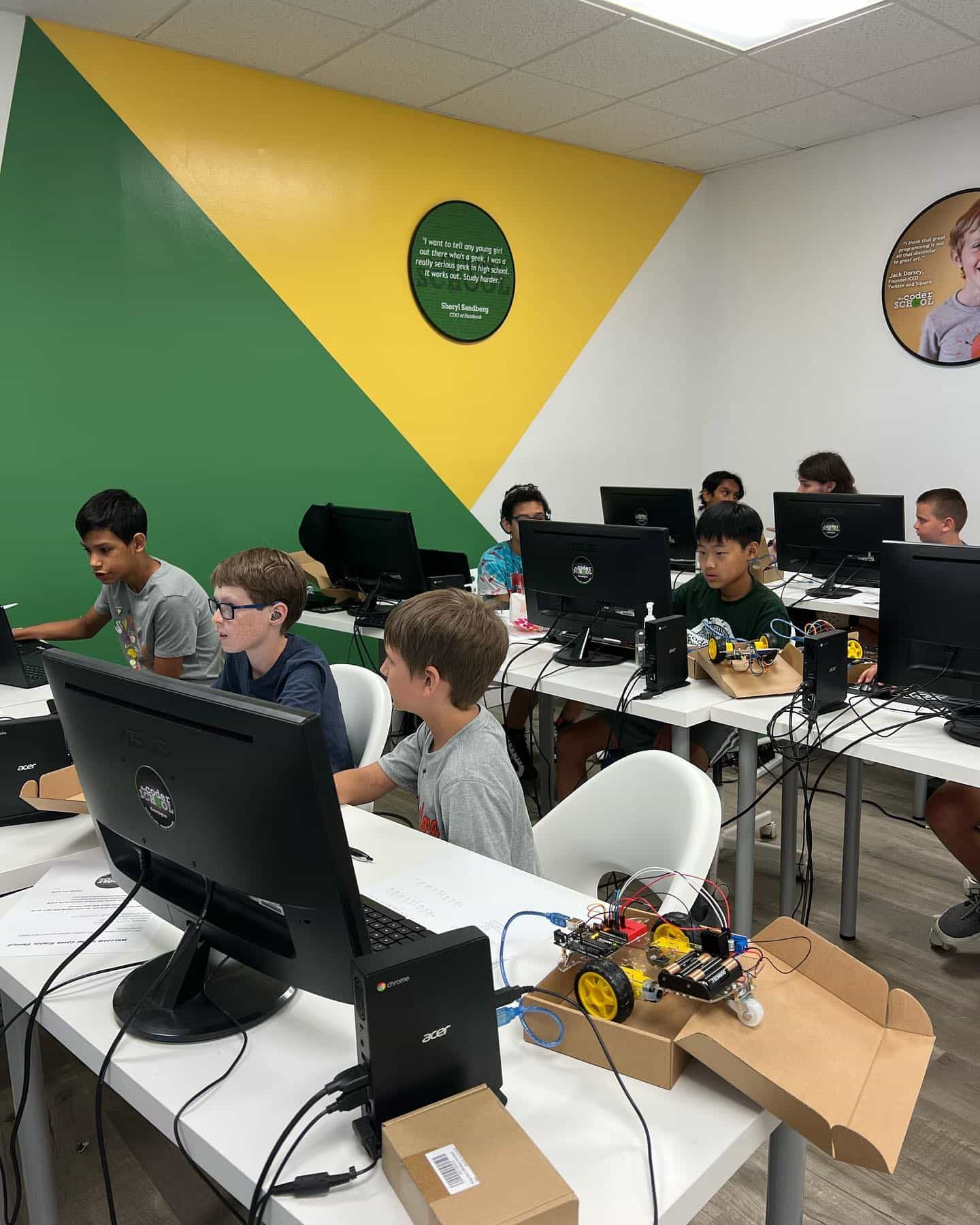 a group of people sitting at computers