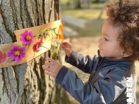 a child holding flowers