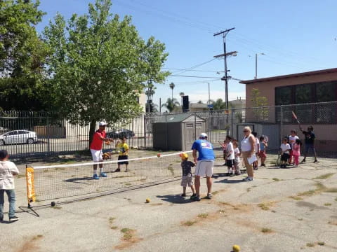 a group of people playing baseball