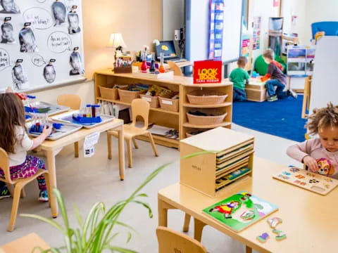 children sitting at desks in a classroom