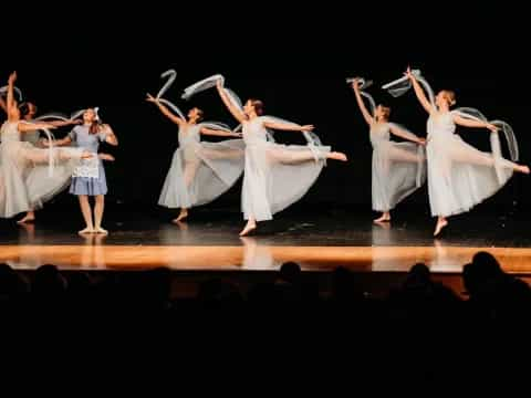 a group of women dancing on a stage