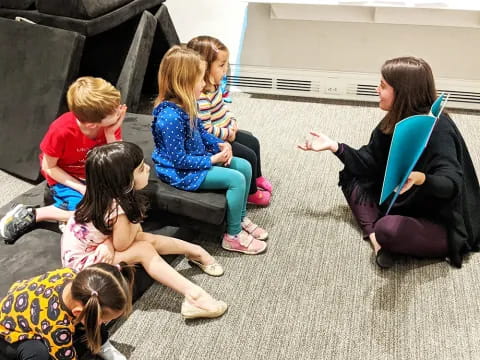 a group of people sitting on the floor