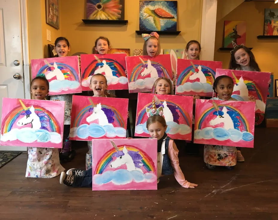 a group of children holding colorful bags