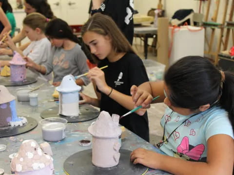 a group of children making cupcakes