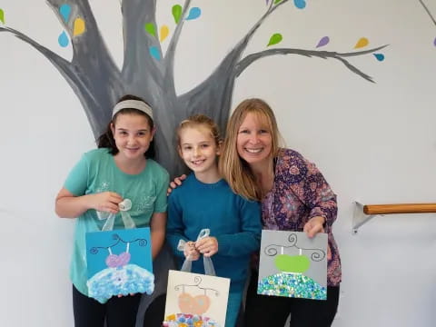 a group of girls holding certificates