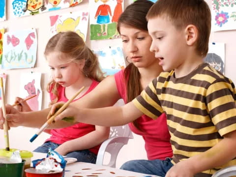 a group of children painting