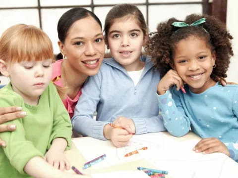 a group of children sitting at a table