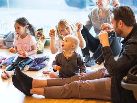 a group of people sitting on the floor