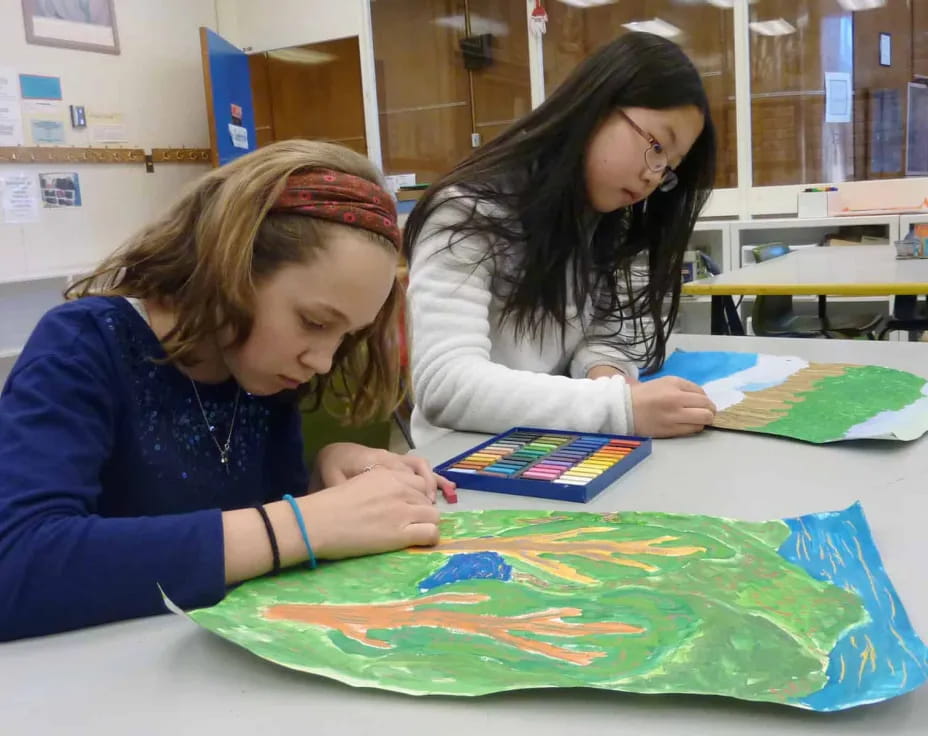 a few young girls painting