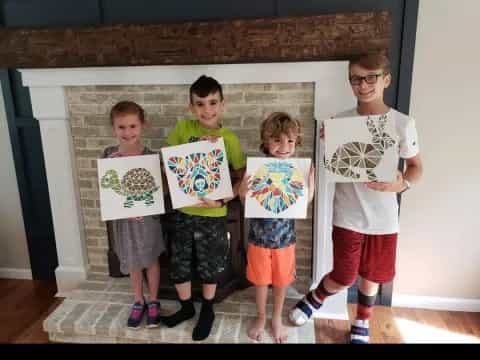 a group of kids holding up signs