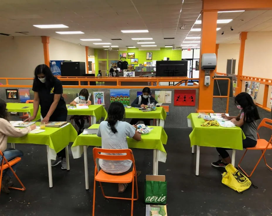 a group of people sitting at tables