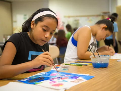 a young girl painting